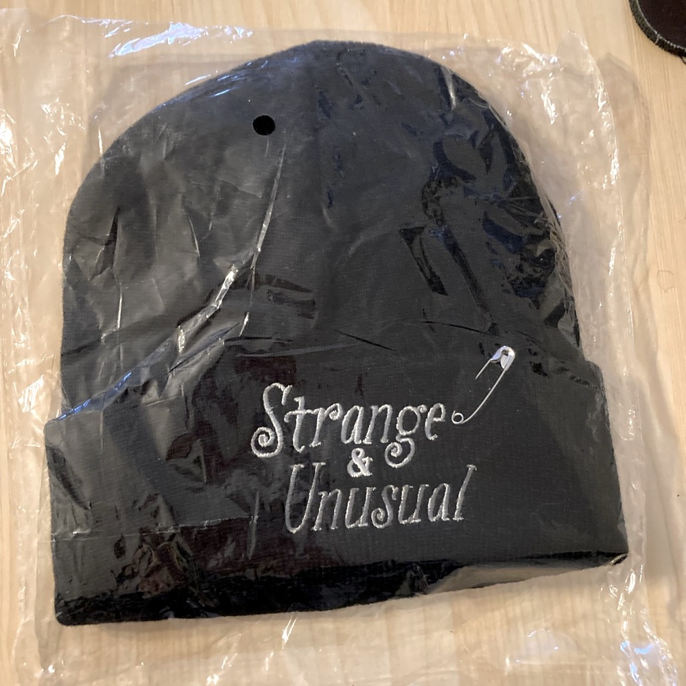 NWT black beanie “strange and unusual”